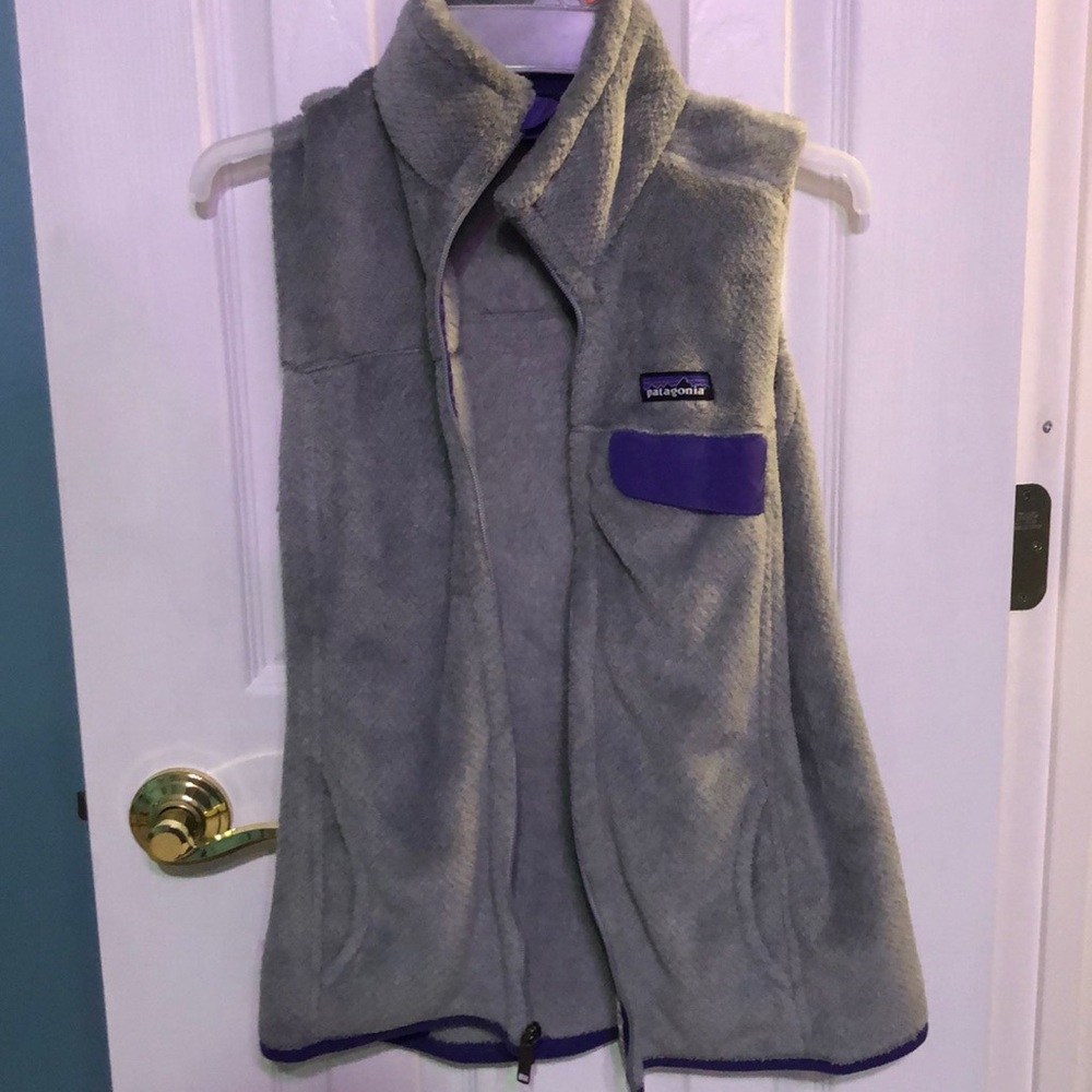 A grey and purple Patagonia vest.